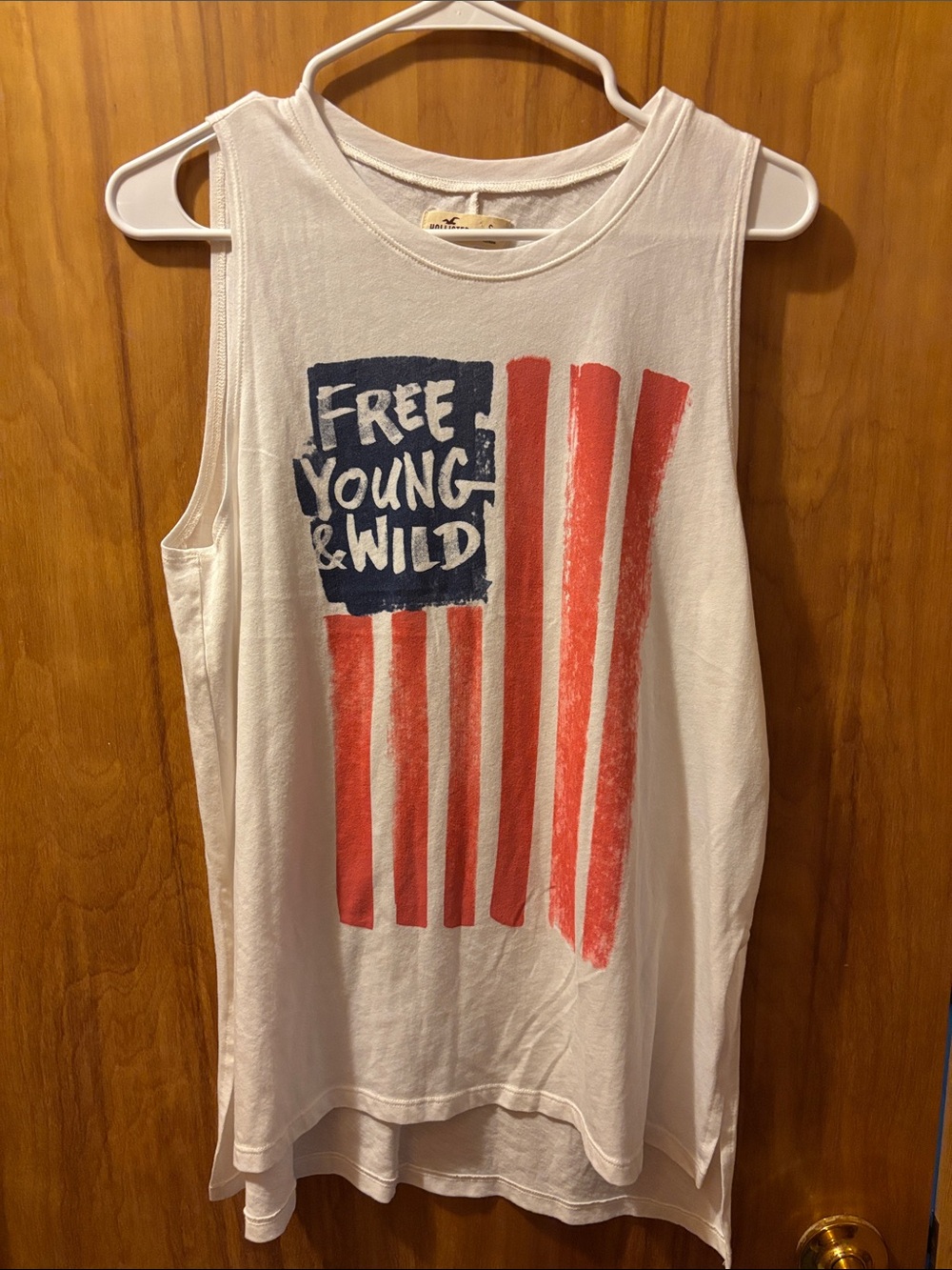 Hollister White Muscle Tank with Navy 'Free Young & Wild' and Red Stripes